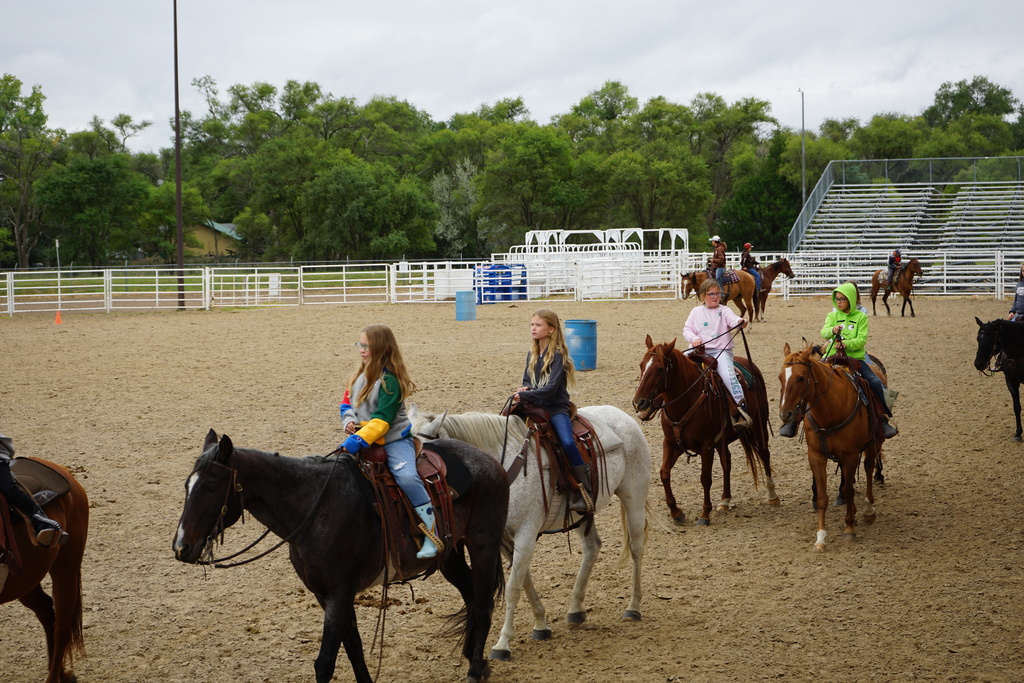 Students riding horses